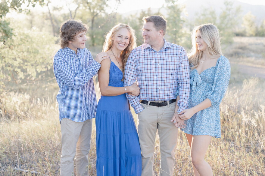 Tiffany Storrs (middle) with her family. Storrs is bilaterally deaf and has two cochlear implants.