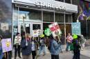People picket at a Starbucks in New York on Friday, Nov. 14, 2025, as striking workers call for a union contract. (Ted Shaffrey/AP)