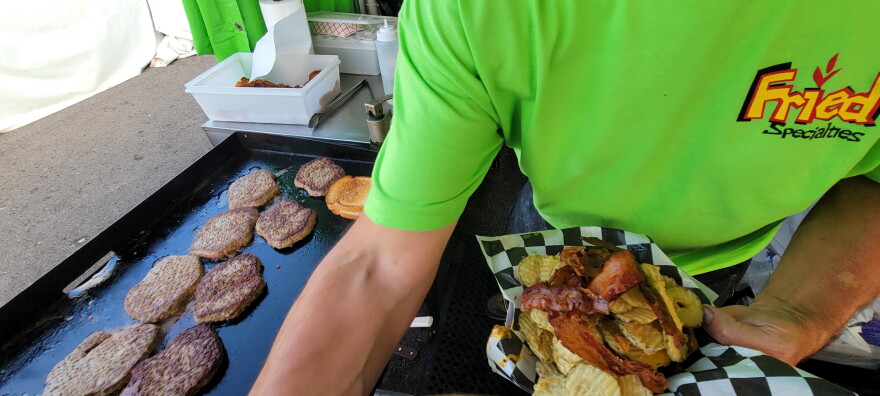The Defibrillator — a half-pound burger patty grilled and deep-fried, a mound of deep-fried pickles, bacon cooked in the deep fryer — lacks only the grilled cheese sandwich on top to complete the meal.