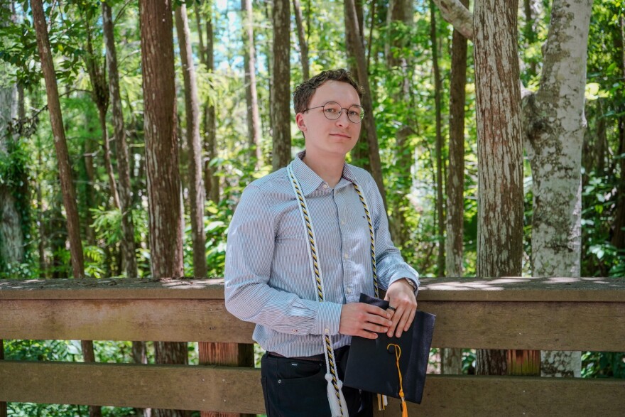 Anthony Zarczynski poses for a graduation photo earlier this year spring. Zarczynski, who graduated from the University of Central Florida this spring with a degree in digital media, has been navigating an especially challenging job market as generative AI upends the entry-level job market for recent college graduates.
