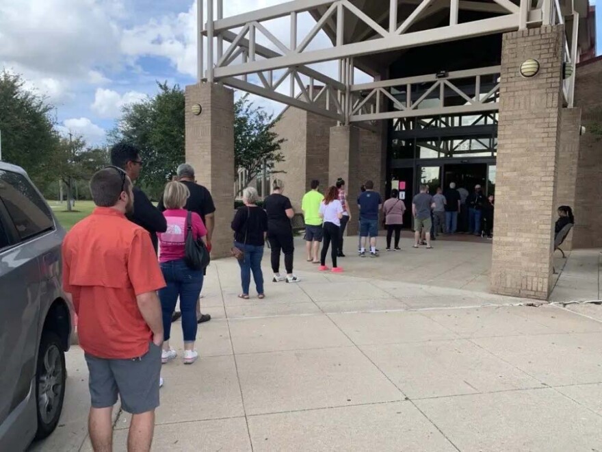 Voters on line outside the Tom Reid Library in Pearland, Texas, October 22, 2024.