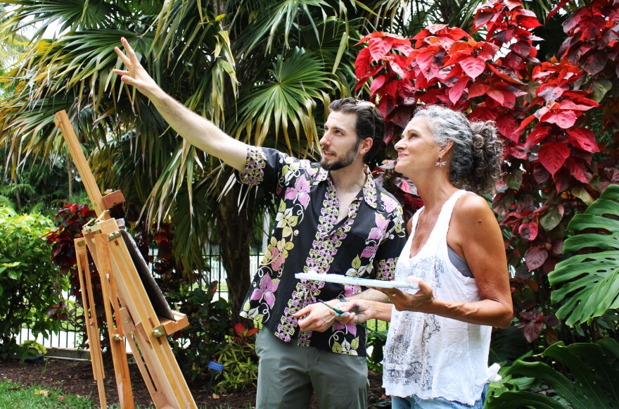 Wesley Truman Daniel (left), the great-grandson of Harry S. Truman points out features of the Truman Little White House to plein air event attendee Vicki Golay (right) on Friday, April 12, 2024 in Key West. The outdoor painting event helped commemorate the 79th anniversary of former President Harry S. Truman taking office in 1945 after the death of Franklin D. Roosevelt.