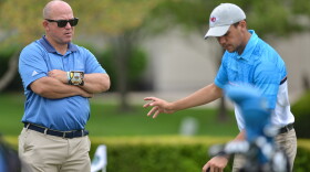 UMKC golf coach J.W. VanDenBorn listens to senior golfer Paul Foulquie on the practice green at Loch Lloyd on April 29. Foulquie is one of three French golfers comprising the Roos' team.