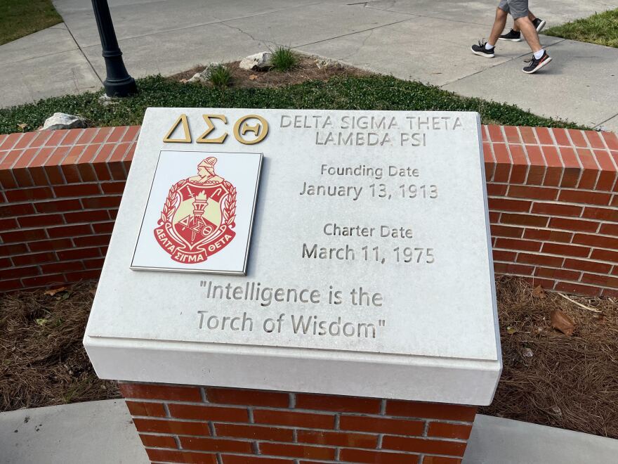 The Lambda Psi chapter of Delta Sigma Theta Sorority plaque in the NPHC Garden. (Keziah Moses/WUFT News)