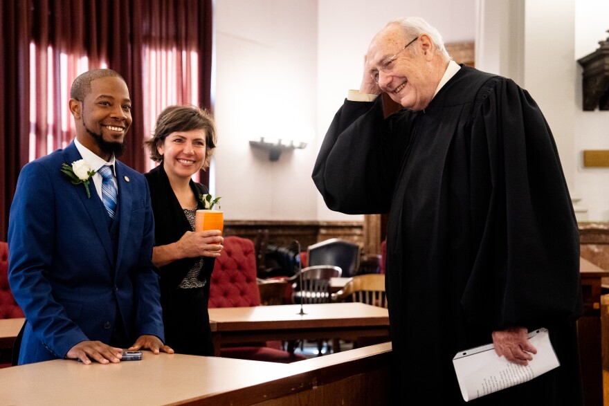 Alderman Rasheen Aldridge (14th Ward) and Alderwoman Cara Spencer (8th Ward) share pleasantries with Judge Michael A. Wolff on Tuesday, April 18, 2023, before the 2023-24 St. Louis Board of Aldermen’s inauguration at City Hall.