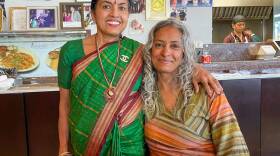 Restaurant owner Padmini Aniyan (left) with host Deepa Fernandes. (Allison Hagan/Here & Now)