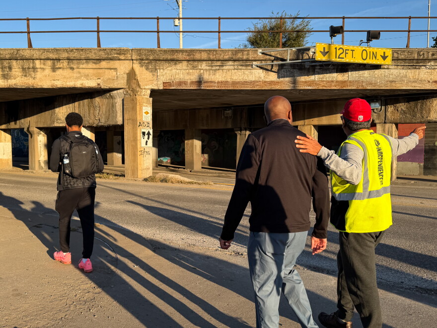 Quinton Lucas approaches a low-hanging bridge along Independence Avenue in Kansas City.