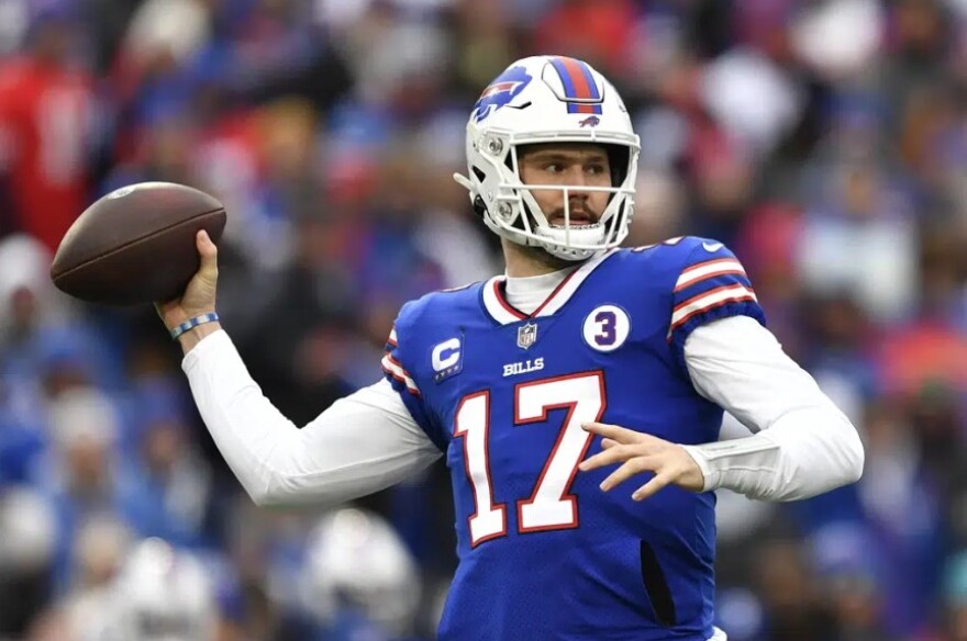 Buffalo Bills quarterback Josh Allen (17) passes during the first half of an NFL football game against the New England Patriots, Sunday, Jan. 8, 2023, in Orchard Park.