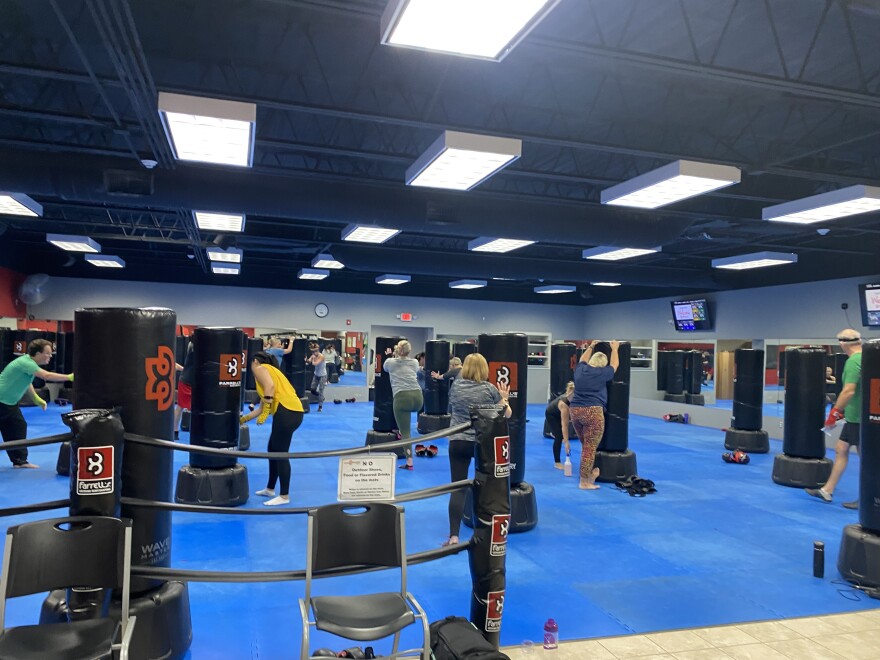 Participants of Farrell's 10-week program in a kickboxing class at the East Peoria location