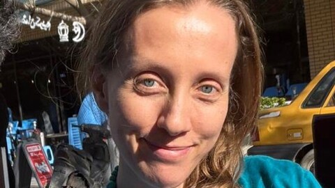 U.S. journalist Shelly Kittleson poses for a cellphone photo in a cafe in Baghdad, Iraq, Monday, March 30, 2026.