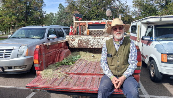David Temple sits in an empty truck bed after handing out trees at the Cortez Public Library.