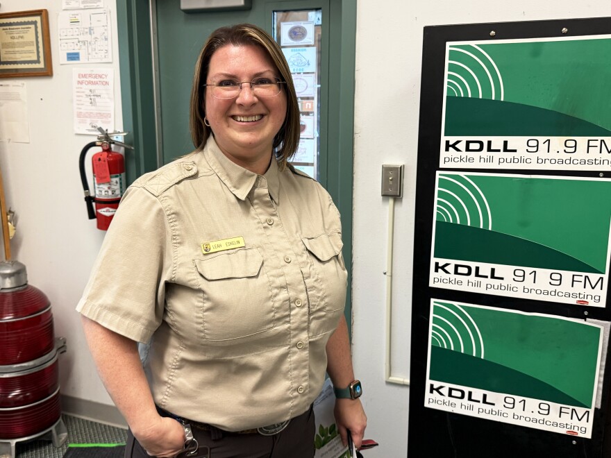 Kenai National Wildlife Refuge Park Ranger Leah Eskelin stands in the KDLL office on Monday, June 23, 2025 in Kenai, Alaska.