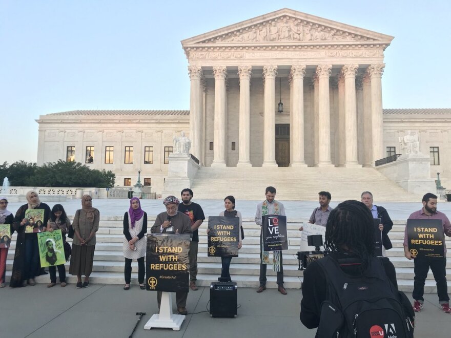 Members of MPower Change and allies stand in solidarity for refugee rights on the steps of the Supreme Court before breaking fast.