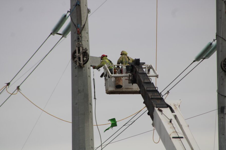 In an undated photo, workers install cables at the Nebraska Public Power District Princeton Road generating station in Martell, Nebraska.