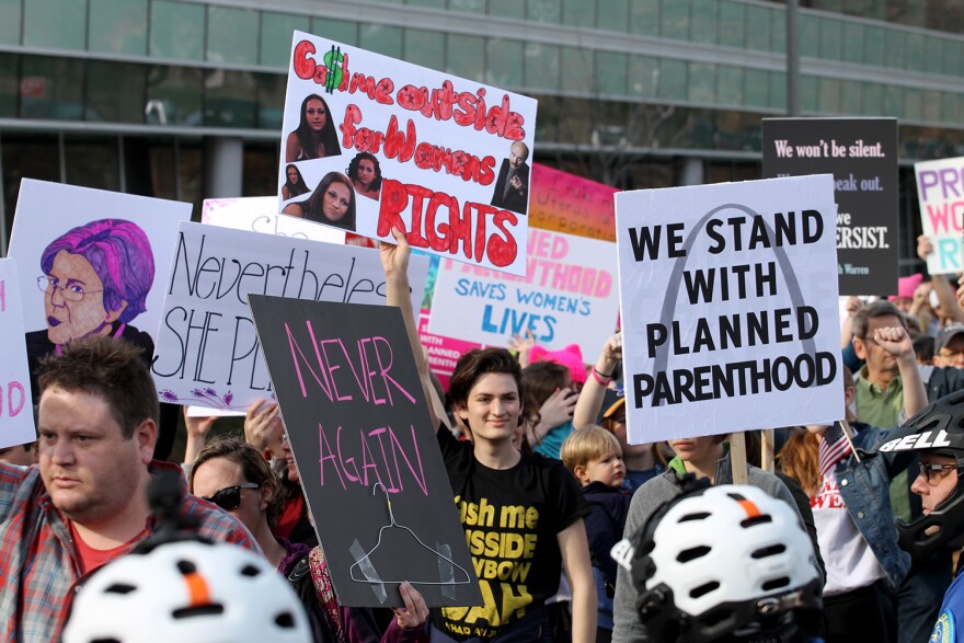 Planned Parenthood supporters marched silently past the organization's Central West End clinic as anti-abortion activists prayed during a 2017 demonstration.
