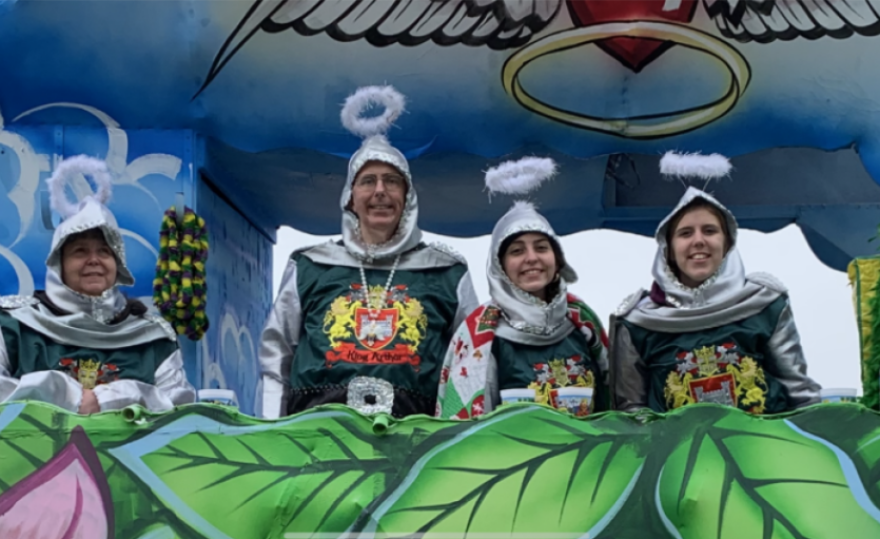 Dr. Rose Angelocci (left) riding on a float at the Krewe of King Arthur parade with her family