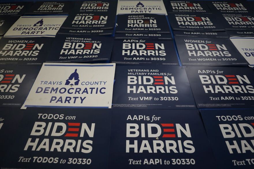 Joe Biden signs cover the wall at the Travis County Democratic Party's Southwest office on election night. 