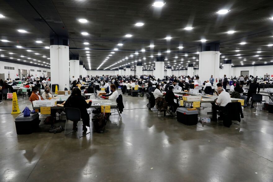 Election workers work on counting absentee ballots for the 2020 general election at TCF Center on Nov. 4, 2020 in Detroit.
