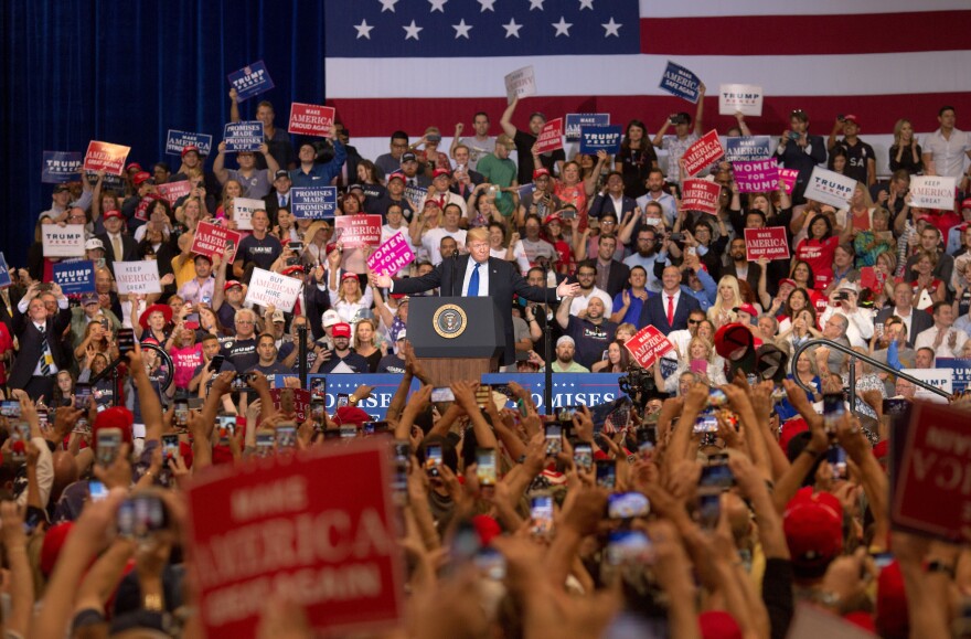 Trump urges a crowd to vote for Heller at a rally at the Las Vegas Convention Center on Sept. 20.