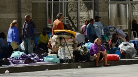 Homeless people rest on a public sidewalk early this year in downtown skid row area of Los Angeles. The United Way of Greater Los Angeles is attempting to end "chronic homelessness" by 2016 with a model that identifies the neediest cases and provides them with permanent homes.