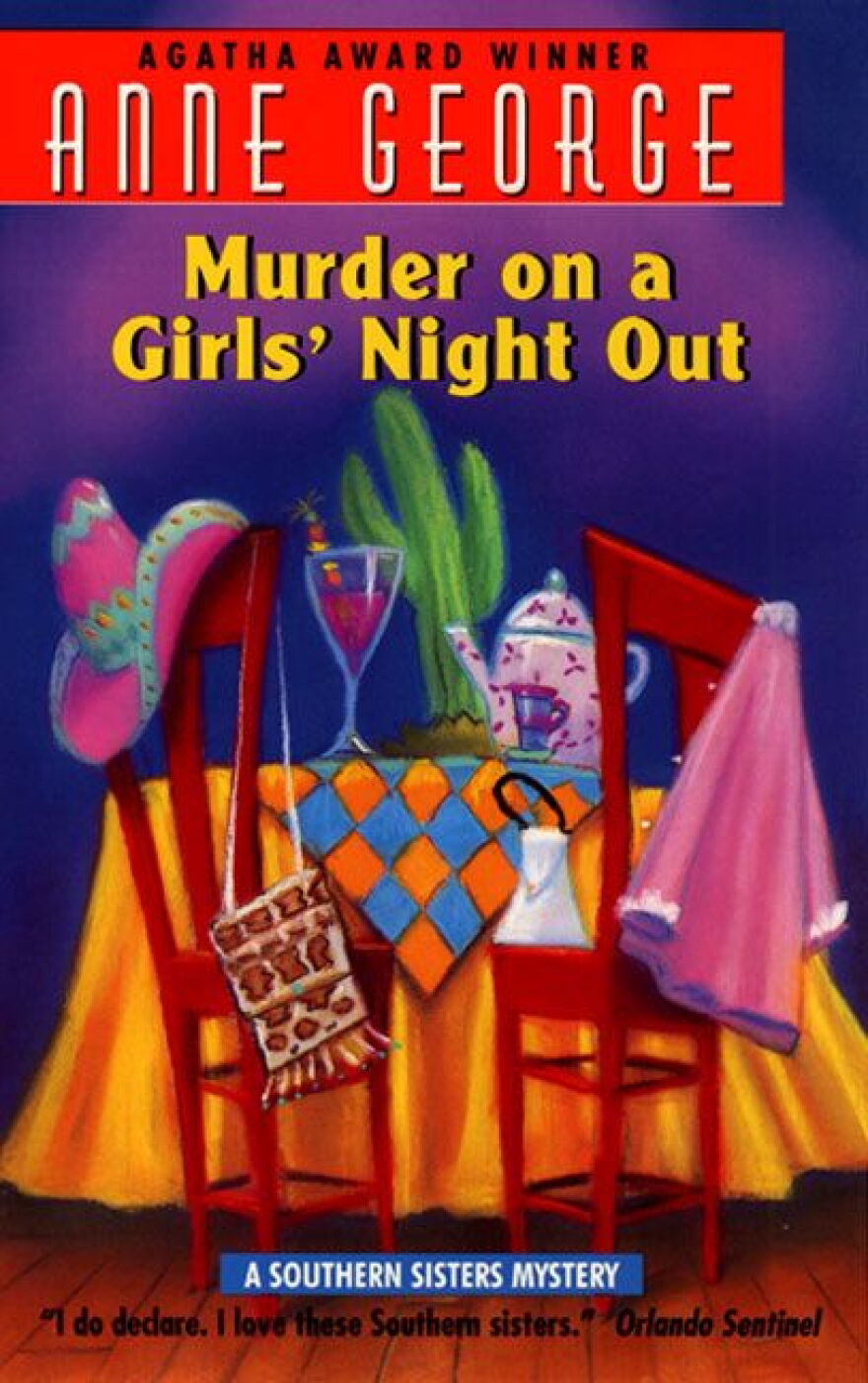 The cover of Murder on a Girls' Night Out. It features an illustration of a table with an orange table cloth on a wooden floor. On the table is a cactus, a martini glass and cup of tea with a pitcher of tea. Next to the table are two red chairs. On the left chair is a sumbrero and a purse hanging from it. On the right chair is a purple night gown.