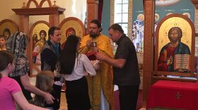 Rev. Migunov at the time of communion at the Russian liturgy at the Greek Orthodox Church, St. Elizabeth. Despite the current political situation in Ukraine, some local Russians and Ukrainians come together once a month and celebrate their common faith.