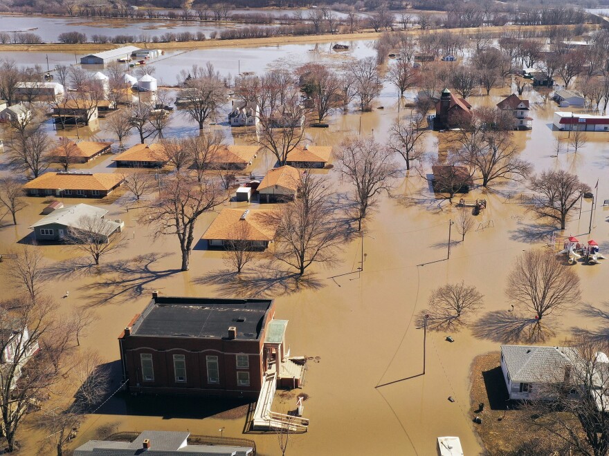 Homes and businesses are surrounded by floodwater Wednesday in Hamburg, Iowa.