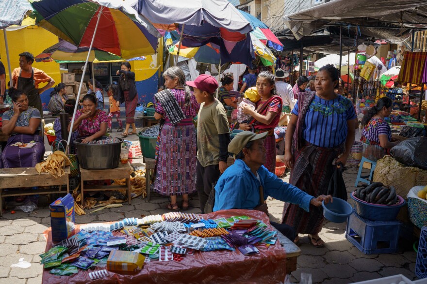 Local Tz'utujil Maya people shop and sell at the Santiago Atitlán market. Santiago Atitlán, Sololá, Guatemala.