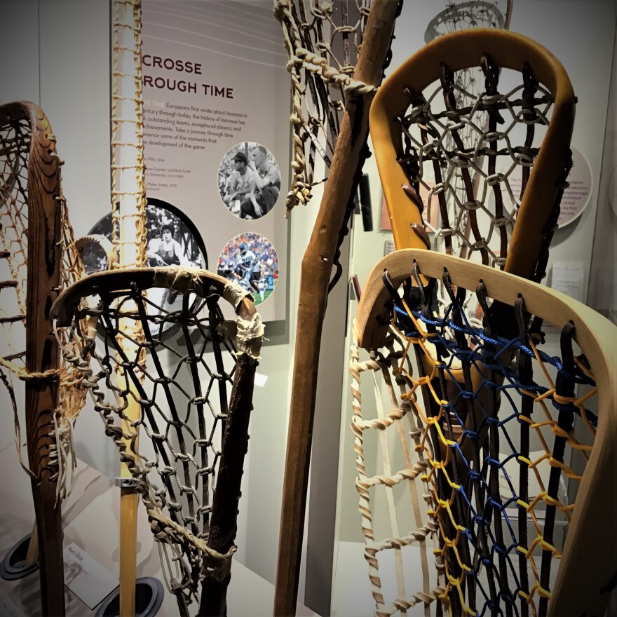 Traditional lacrosse sticks on display at the National Lacrosse Hall of Fame and Museum (photo credit Aaron Henkin / WYPR)