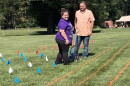 Volunteers create a grid on the lawn at Montpelier to prepare for the creation of a living flag.