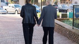 Gainesville newlyweds Karen NiederKohr (right) and Lola Yousey (left) walk out of the Alachua County Courthouse on Tuesday, Jan. 6 after receiving their marriage licenses.
