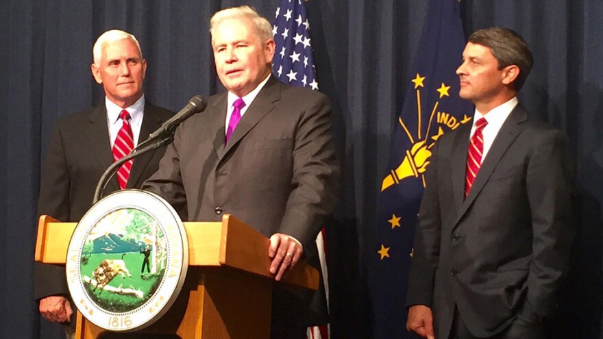 Jim Schellinger, center, was named the head of the Indiana Economic Development Corporation in 2015 by then-Gov. Mike Pence, left.
