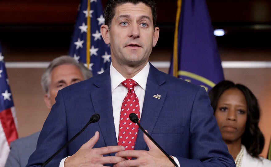 House Speaker Paul Ryan talks with reporters Tuesday. He said that Russia "did meddle with our elections" and that he would consider further sanctions against Moscow.