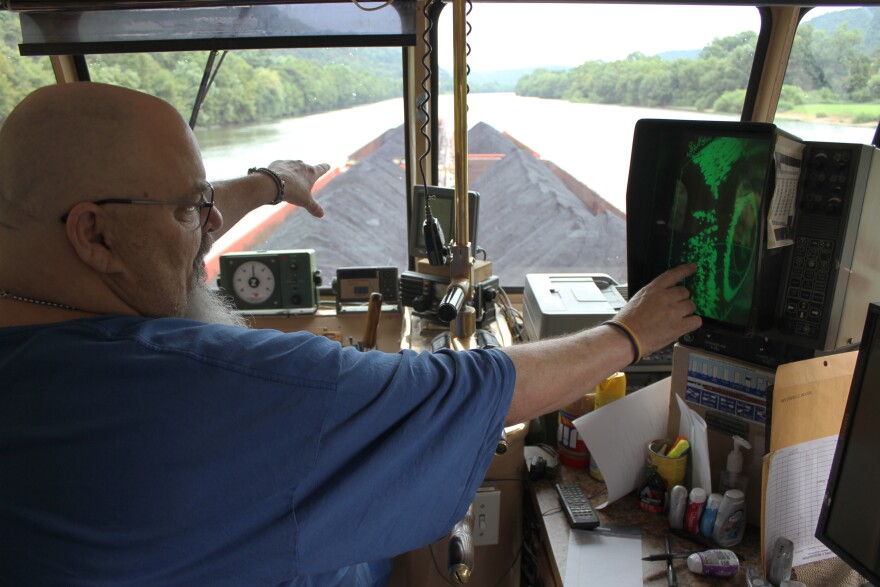Captain Marvin Wooten pushes five loads of coal along the Kanawha River. He has worked for Amherst Madison since 1979. 