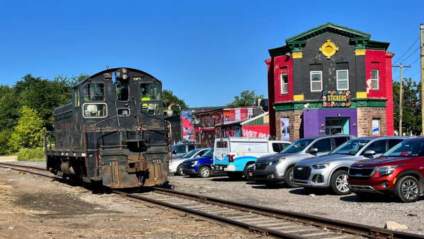 A freight locomotive on the Luzerne County-owned rail line passes South Wilkes-Barre businesses along Horton Street in 2024.