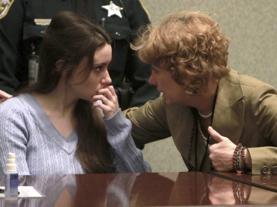 Casey Anthony talks with her attorney, Dorothy Clay Sims, before a sentencing hearing in Orlando, Fla. on Thursday, July 7, 2011. Anthony was acquitted of killing her daughter, Caylee, but faces four charges of lying to police officials.