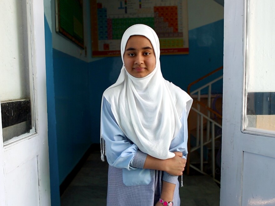 Layli is 15. She's fiesty and says she sometimes wants to punch the boys who make fun of them when they walk to school.
