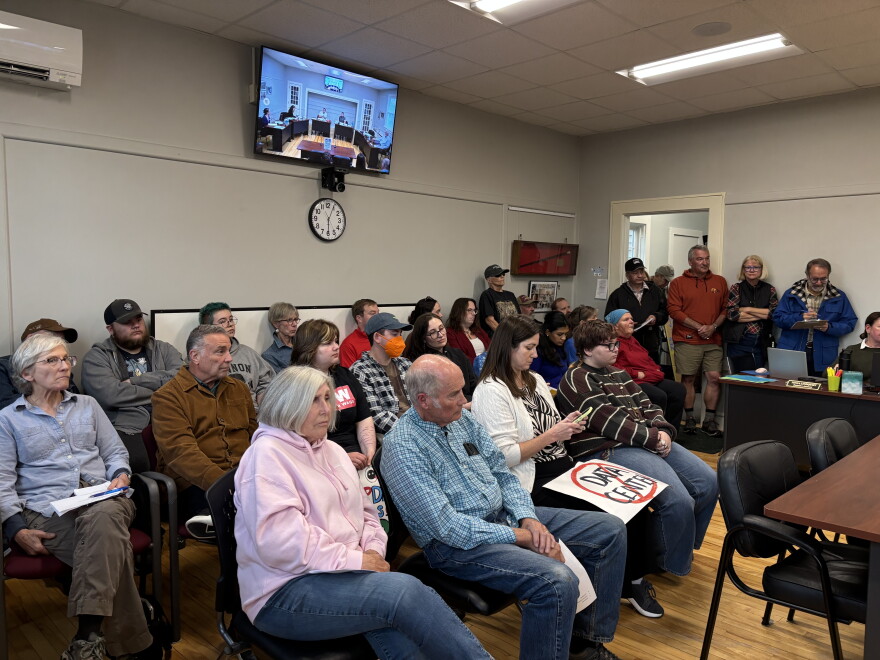 People lined up to speak during a select board public comment session on a potential data center in Bow, NH.