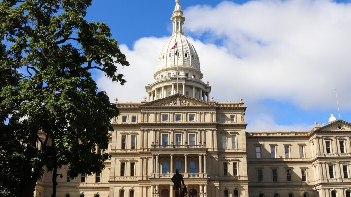 Michigan Capitol building in Lansing on a summer day.