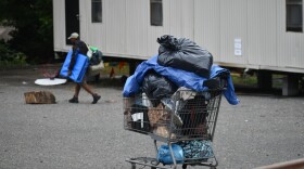 Residents of a homeless encampment behind a Gastonia church move out their belongings on Aug. 28, 2023.