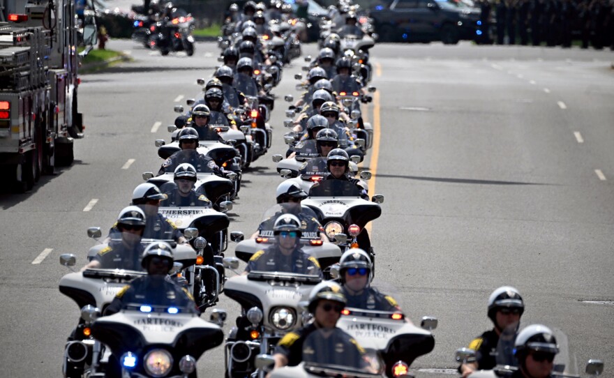 The Police escort for Trooper First Class Aaron Pelletier arrives at Xfinity Theatre for the funeral service in Hartford June 5th, 2024.