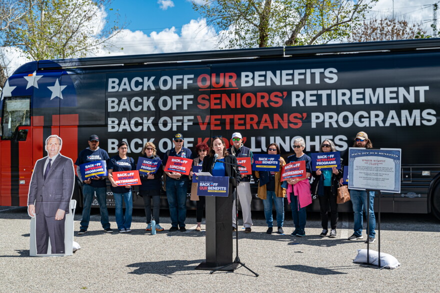 Demonstrators gather at Yokuts Park, outside Congressman Kevin McCarthy's Bakersfield office, to call for the protection of social security and other safety net programs. The Thursday event marks the launch of the nationwide "Back Off Our Benefits" bus tour.