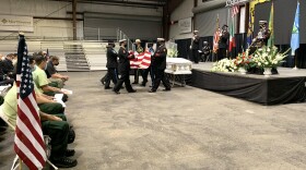 A flag ceremony at the memorial for Frumencio Ruiz Carapia. He was killed while fighting the Gales Fire on August 23, 2021.