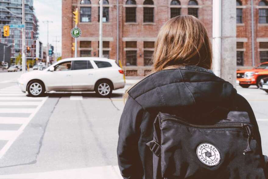 Pedestrians cross a busy street. Photo: Scott Webb @scottwebb