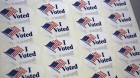 A close-up of sheets of I Voted stickers ready to be handed out to voters.