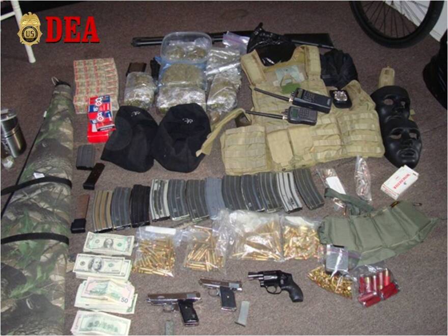 Weapons, drugs and cash seized by federal agents in San Diego.