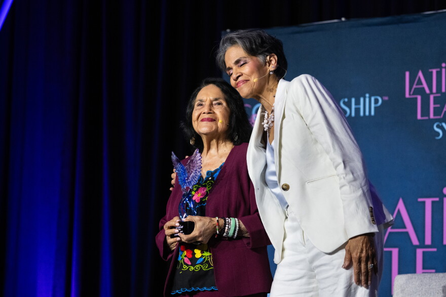 FILE: Dolores Huerta receives the Living Legend Award from Latinas in Leadership founder and CEO Marilyn Alverio at the organization’s symposium at the Connecticut Convention Center in Hartford, Connecticut on May 28, 2026.