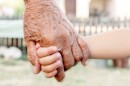 Grandchild and grandparent holding hands