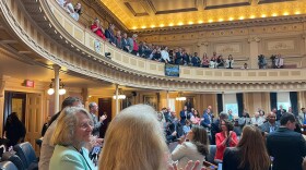 Delegates applaud veterans in the gallery waiting on vote to repeal tuition changes.