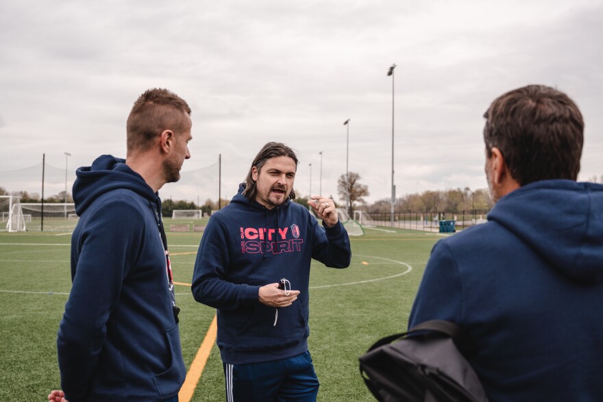 From left: Elvir Kafedzic, Lutz Pfannenstiel and Tim Twellman talk about potential drills to run during the open trial in April. 4/17/2021